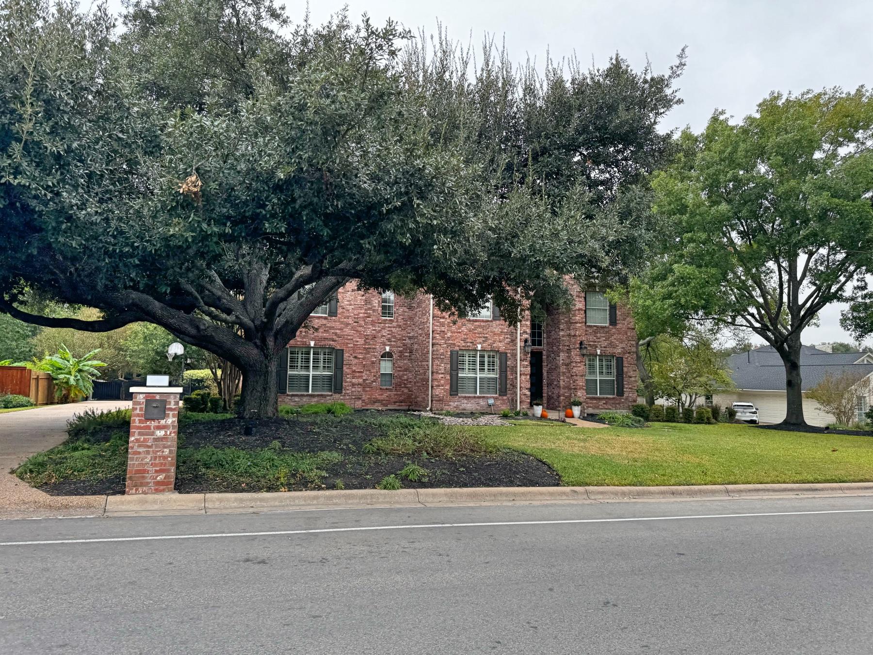 Oak Bluff two story red brick home Round Rock