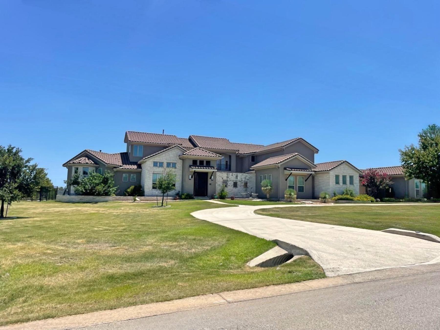 grand mesa home with circle driveway leander