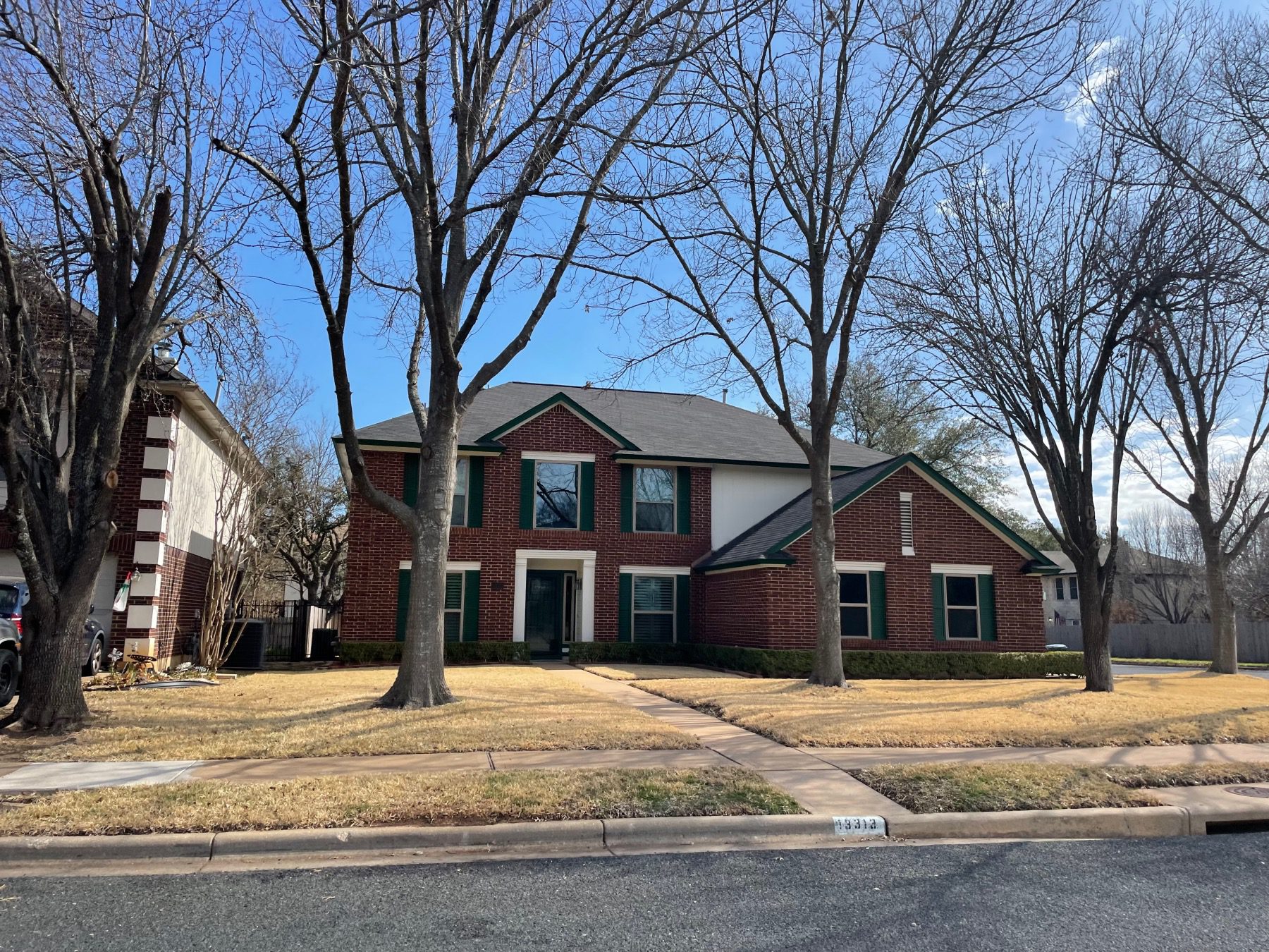 Milwood two story red brick home Austin tx 78729